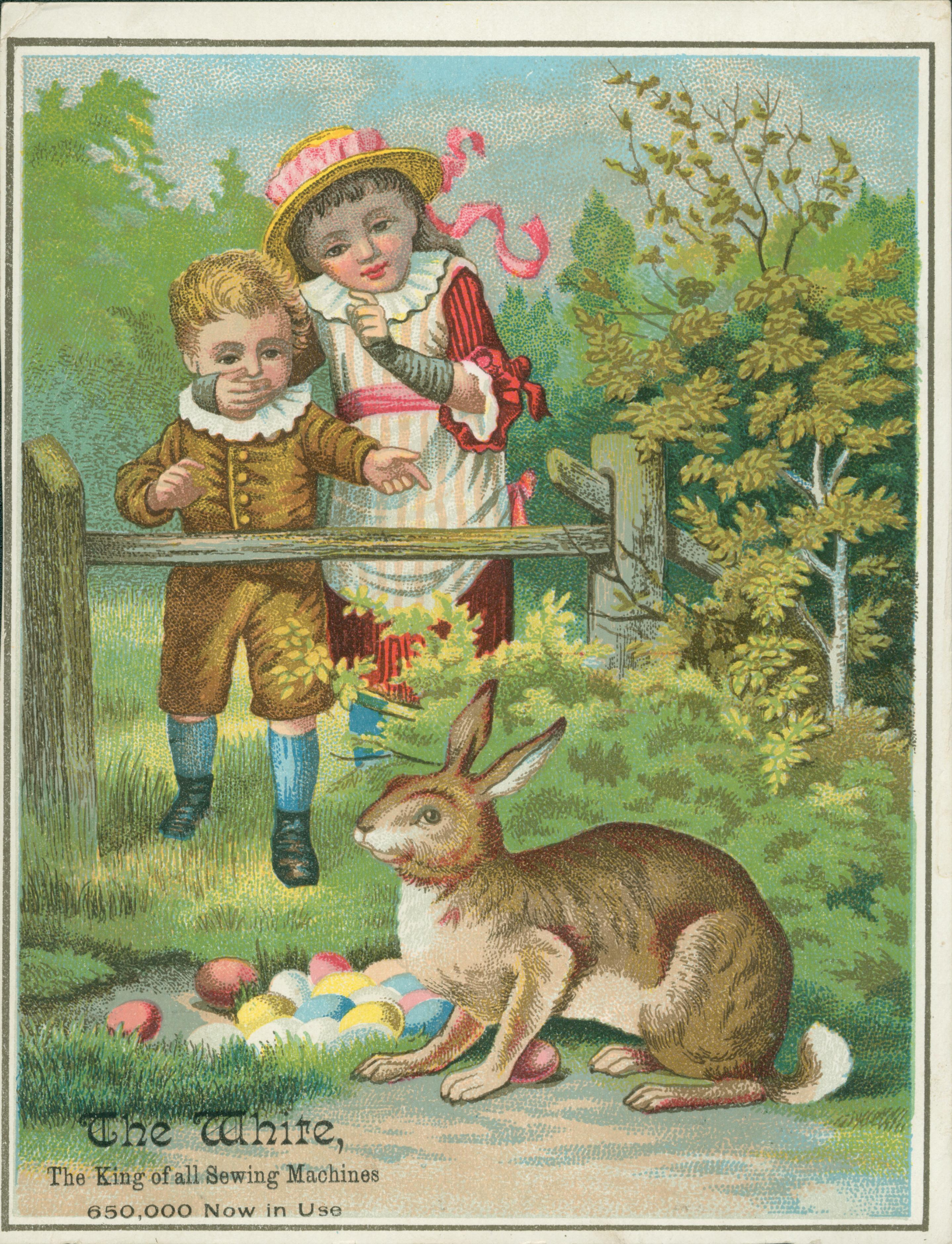 Image shows two children behind fence looking at colored eggs and rabbit.